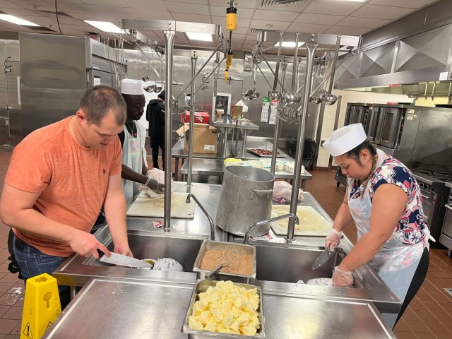 Sgt. 1st Class Taylor Strack with USASOC Soldiers, civilians, volunteer time to serve 750 Thanksgiving meals to those in in the Fort Liberty area.